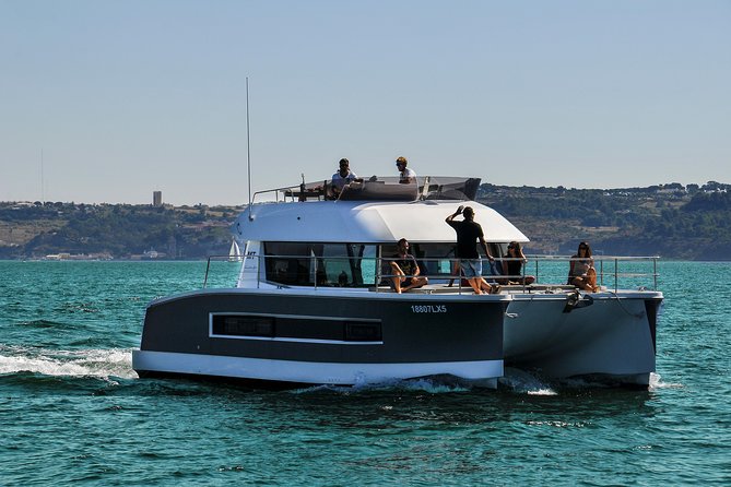 1H power catamaran up to 18 people in Lisbon - The Christ Statue From Across the Water
