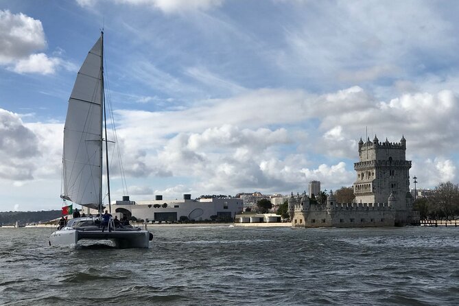 2H Tour on a Private Sailing Catamaran "Scarlett" up to 16 people - Lisbon’s monuments from the water