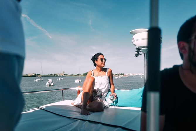 4 Hours Private Tour with Dives in Catamaran in Lisbon - The 25th of April Bridge from the water