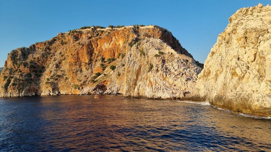 Alanya: Catamaran Boat Trip with Swim Stops and Sunbathing - Red Tower, shipyard, and the first swim