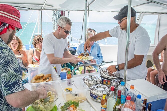 All inclusive CATAMARAN with BBQ : Ile aux cerf & GRSE waterfall - Boarding the catamaran at Trou d’Eau Douce