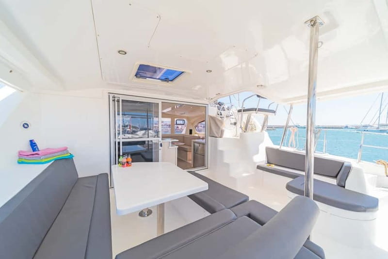 Athens: Half-Day Sunset Catamaran Cruise with Meal & Drinks - Wine, beer, water, and a calm onboard mood