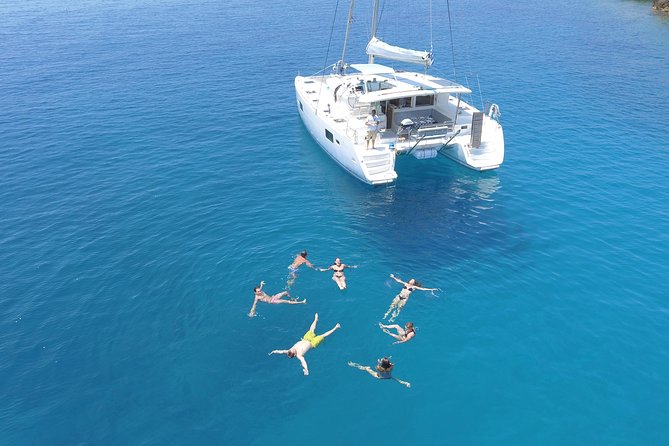 Athens Private Luxury Catamaran Cruise with Traditional Greek Meal and BBQ - Second stop and snorkeling in the deep blue