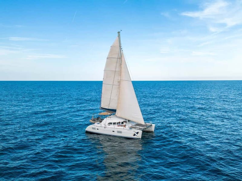 Barcelona: Catamaran Cruise w/ Sailing, Wine, & Tapa - Leaving Port Vell on the OPA
