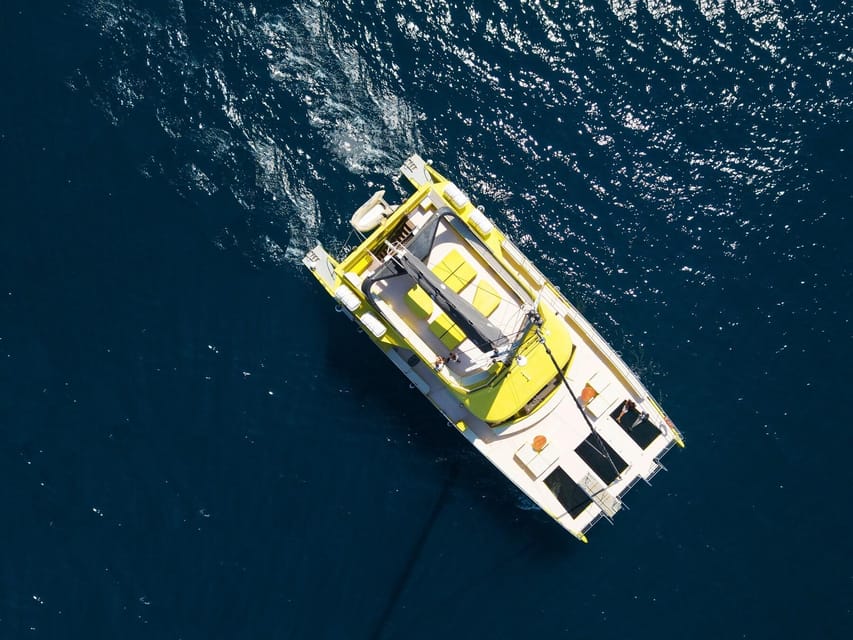 Barcelona: Daytime or Sunset Catamaran Cruise with Music - Boarding at the port and settling into the catamaran