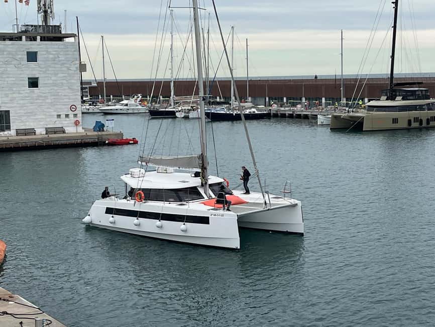Barcelona: Shared cruise on a catamaran Drink+Local Tapa - Following the coast past Barceloneta