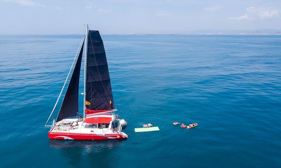 Barcelona: Sunset or Day Catamaran Cruise with Tapa & Drink - What happens during the two-hour sailing