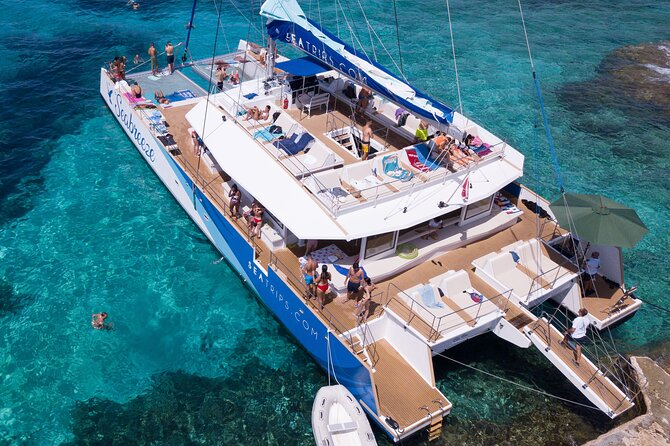 Blue Lagoon, Beaches and Bays Catamaran Sailing Tour - Mellieha Beach, Ramla Bay, and Changing Routes