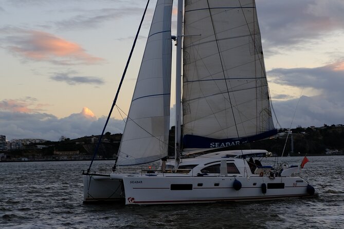 Boat Rental on a Luxurious Catamaran in Lisbon - Under Lisbon’s red suspension bridge