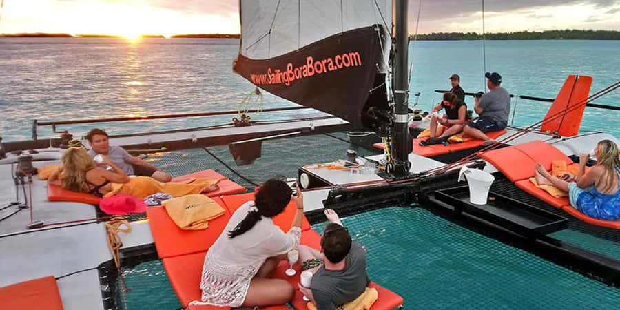 Bora Bora: Sunset Catamaran Cruise with Snacks and Drinks - Sailing past clear water and mountain views