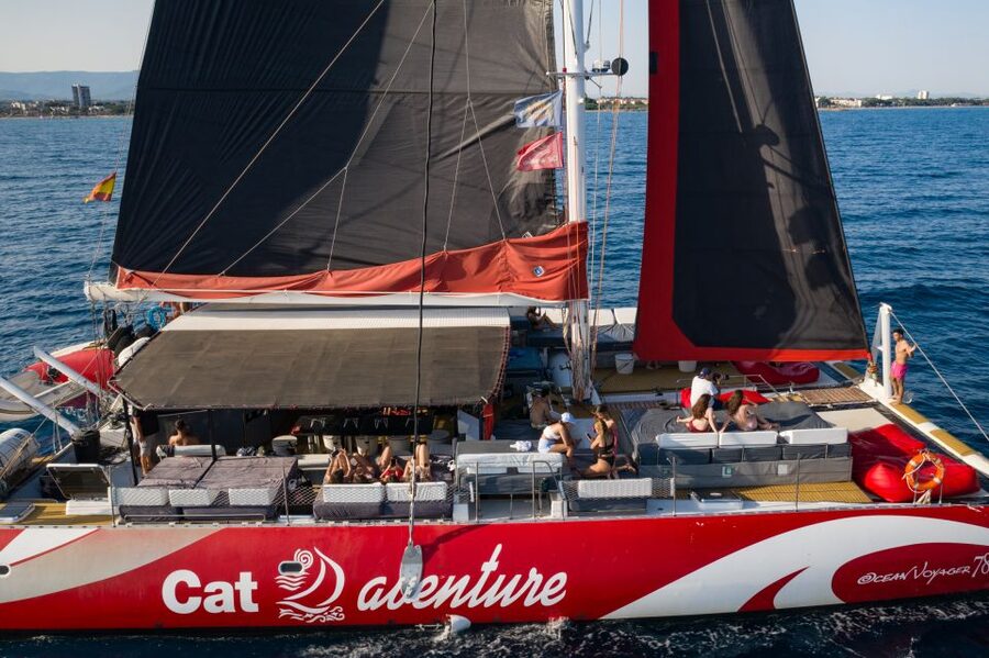 Cambrils: Catamaran Cruise with Drinks and BBQ Lunch Option - The first hour: shoreline views and open-deck relaxation