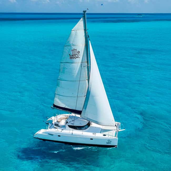 Cancun: Premium Catamaran with Transportation & Dock fee - Sailing toward Isla Mujeres and Playa Norte