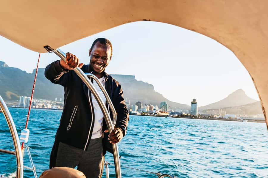 Cape Town: Sunset Catamaran Cruise on Table Bay with Bubbles - Sailing past Milnerton Lighthouse