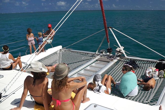 Catamaran Adventure Full Day: Ile aux cerfs,GRSE Waterfall,Snorkeling &BBQ Lunch - What the catamaran atmosphere is really like