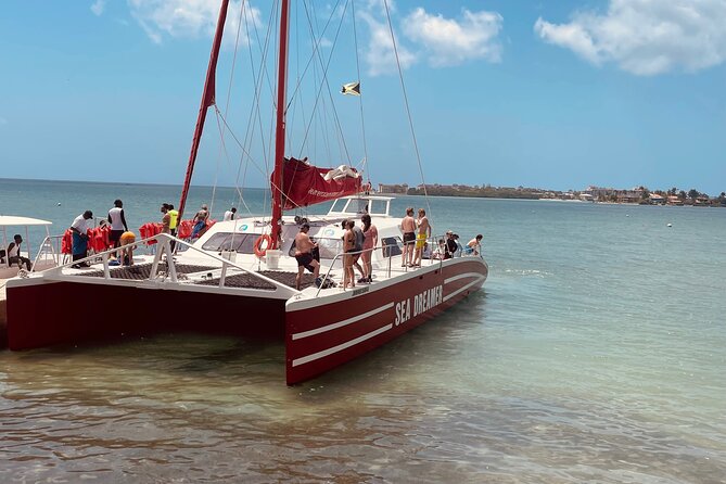 Catamaran Party Cruise and Snorkeling in Montego Bay - Cruising past the Saint James coast