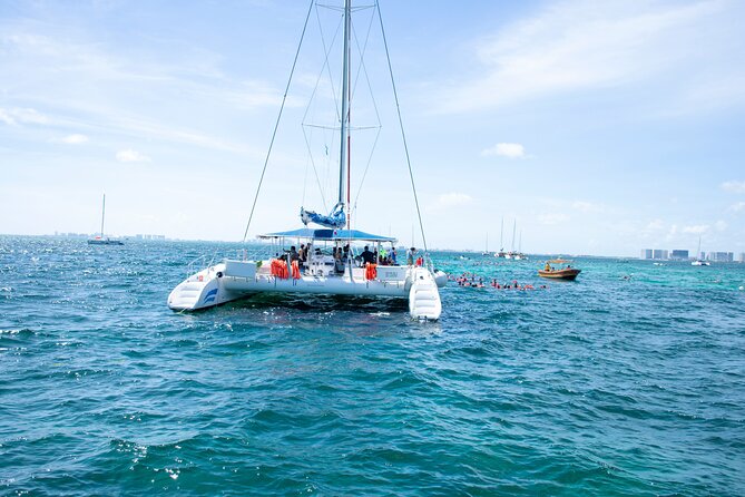Catamaran Party on the Caribbean Sea to Isla Mujeres - Music, dancing, and the possible spinnaker flight