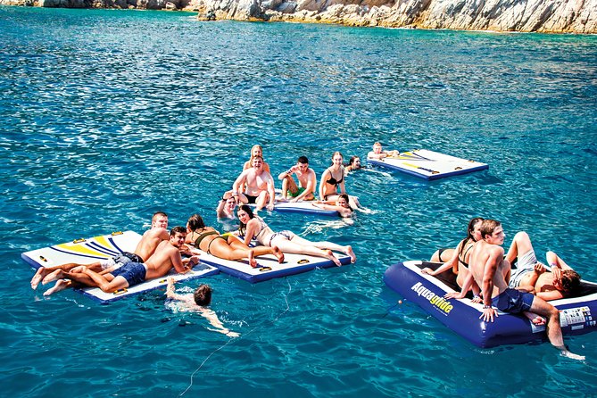 Catamaran ride -Costa Brava with barbecue and drinks. Familiar. - The Swimming Stop Near Tossa