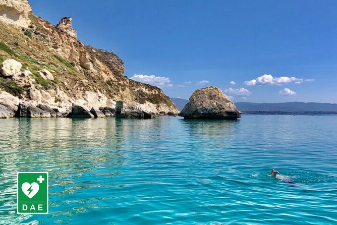 Catamaran tour stops bathing and snorkeling toast with prosecco - Leaving Cagliari Port by Water