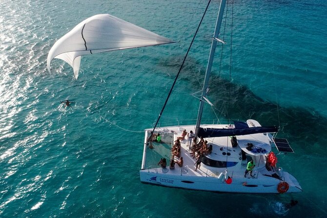 Catamaran Tour to Isla Mujeres, Open bar, Lunch, Snorkeling, Beach Club Included - What this Cancun catamaran day is really like