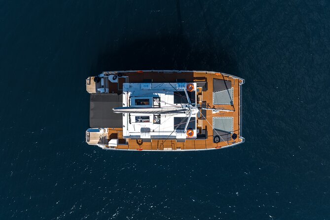 Comfort Max Catamaran Caldera Cruise with BBQ and Drinks - Indian Rock, the lighthouse, and caldera views