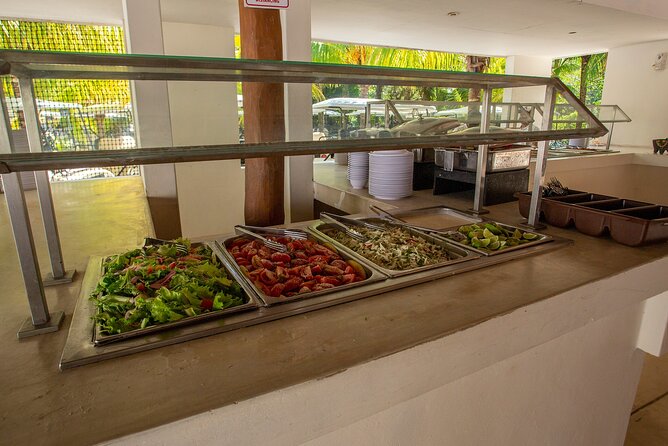 Deluxe Catamaran tour to Isla Mujeres with Open Bar and Lunch - Snorkeling at El Meco from 11:00 to 11:45 AM