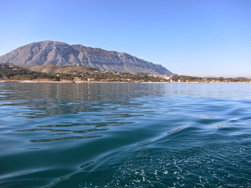 Denia: Cova Tallada Catamaran Tour and Swimming Stop - Music, drinks, and the simple onboard rhythm