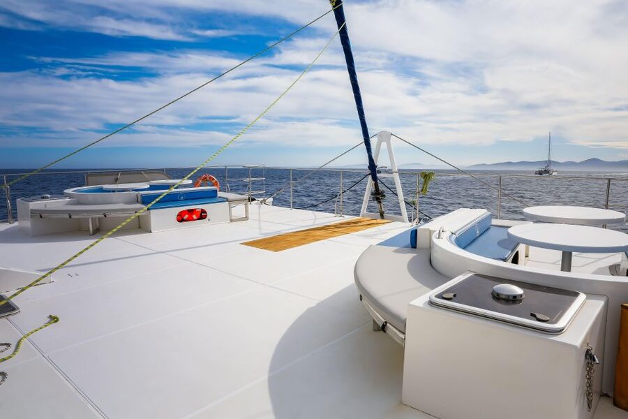 Denia: Cova Tallada Catamaran Tour and Swimming Stop - The ride toward Las Rotas and Javea
