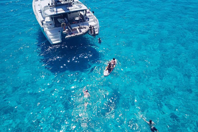 Discover Cala Bassa and Cala Comte on board a catamaran - Starting in Sant Antoni for an eight-hour boat day