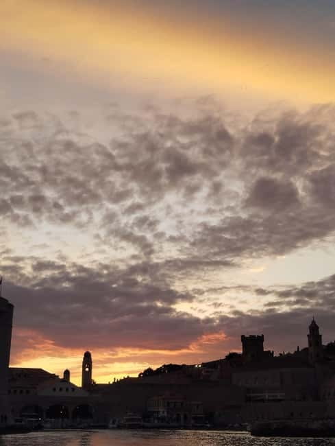 Dubrovnik: Sunset Catamaran Cruise with Sparkling Wine - A glass of sparkling wine at sunset