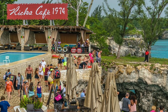 Family Catamaran Cruise from Jamwest Beach Negril Hotels - Rick’s Cafe at sunset