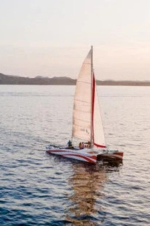 Fornells: Catamaran Sunset Cruise of Menorca's Coast - Leaving Fornells as the light softens
