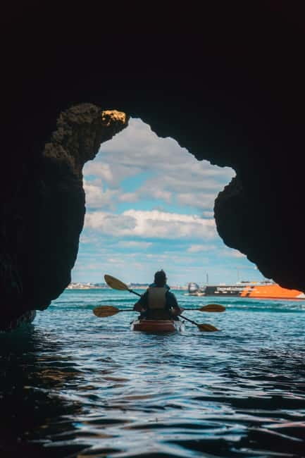 From Lagos: Ponta da Piedade Caves Kayak Tour from Catamaran - The short swim, sun break, and boat slide