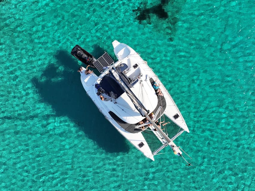 From Ornos: Mykonos Delos Catamaran Cruise with Meal & SUP - Returning toward Mykonos