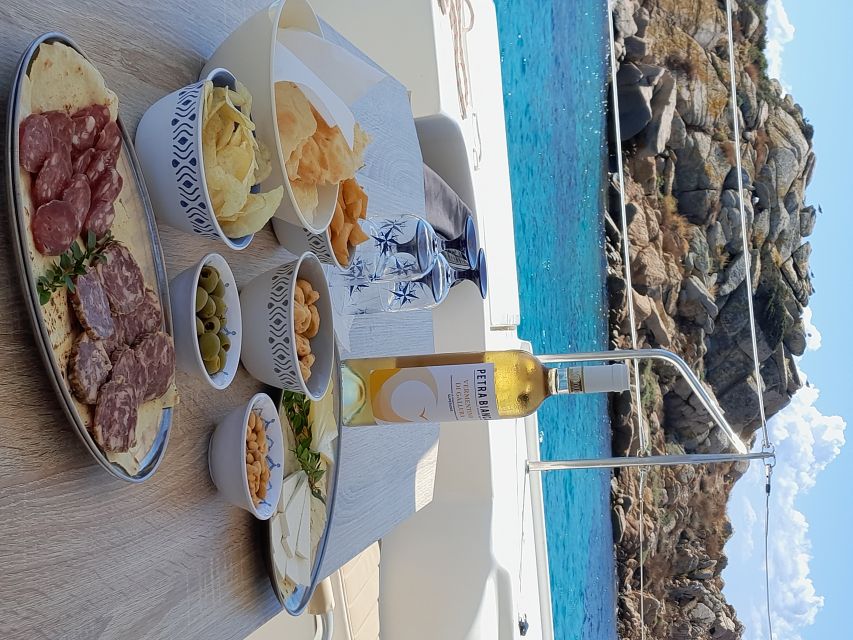 From Palau: Maddalena Archipelago Catamaran Tour with Lunch - Swimming and snorkeling in clear Mediterranean water
