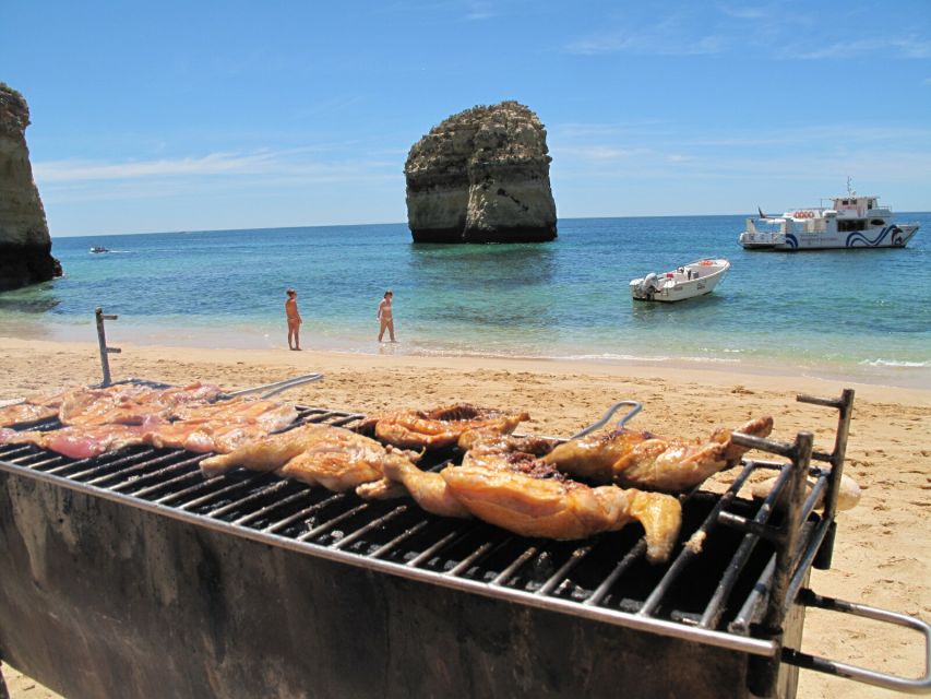 From Portimão: Catamaran Cruise to Benagil Caves with BBQ - Entering the Benagil caves by dinghy