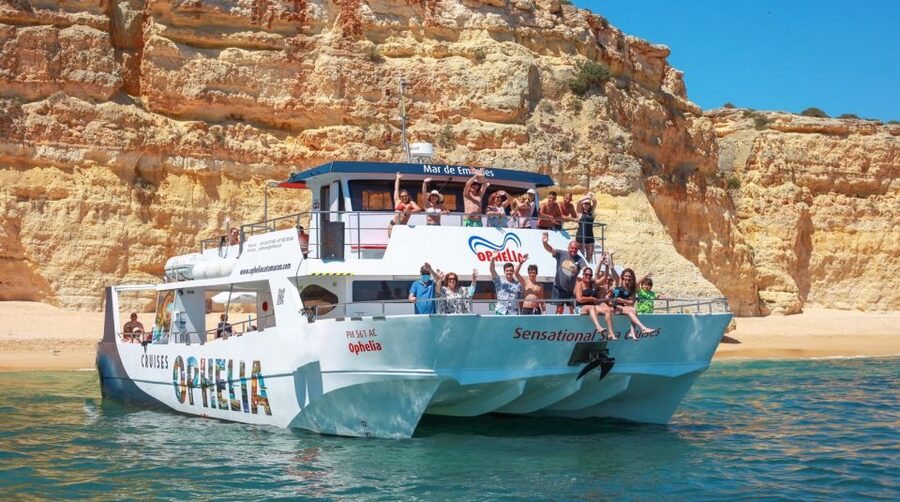 From Portimão: Catamaran Cruise to Benagil Caves with BBQ - Setting out past Ferragudo Castle