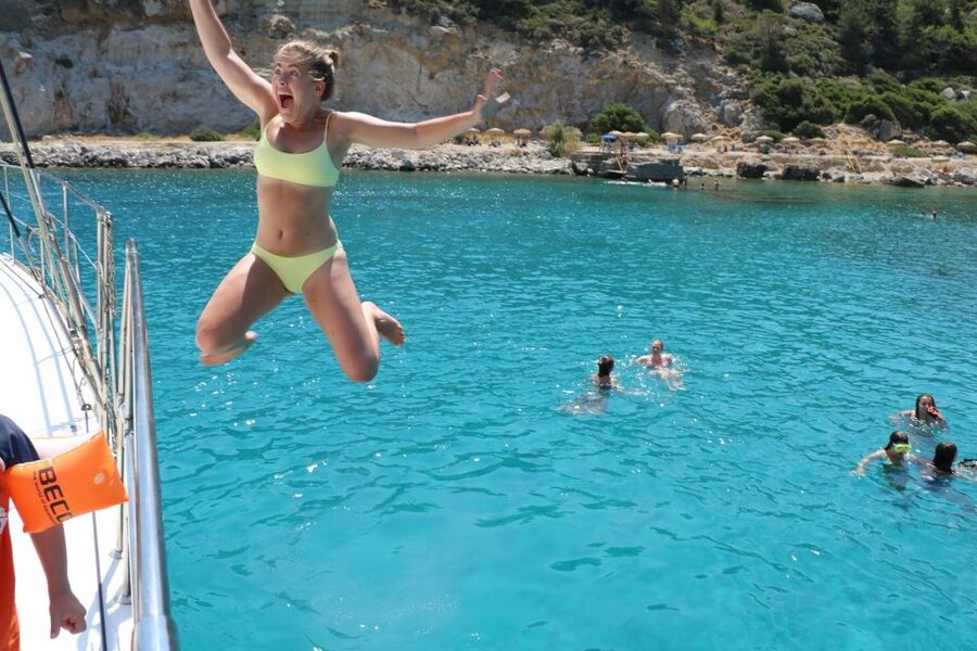 From Rhodes: Private Catamaran Cruise All Inclusive - Anthony Quinn Bay: rocky coves and strong coastal views