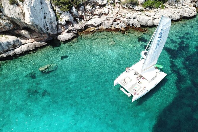 Full day Catamaran cruise in Porto Conte Natural Park - Cala Dragunara: emerald water near Alghero