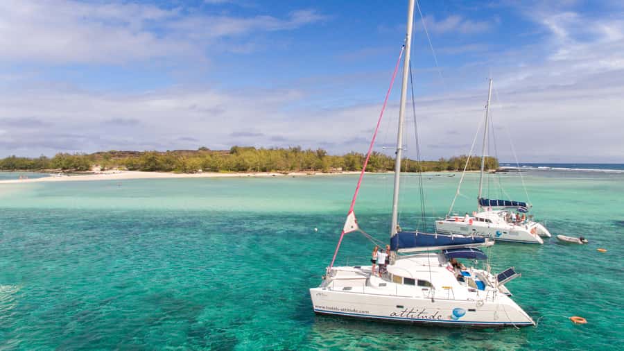Full Day Catamaran Luxury Cruise to Northern Islands w Lunch - Sailing Past Gunners Coin’s Sheer Cliffs