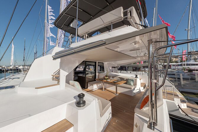 Full-Day Private Tour in Santorini by Luxury Catamaran - Akrotiri Lighthouse and Black Mountain from the sea