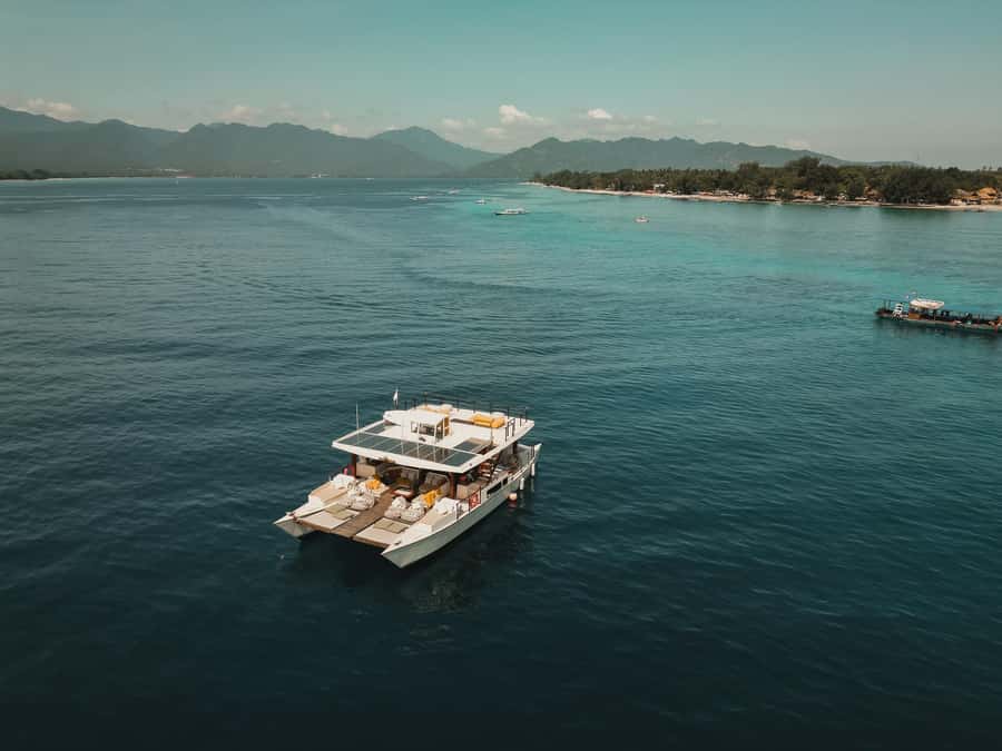 Gili Islands: 4-in-1 Catamaran Snorkeling Experience - Paddleboards, beanbags, and roof-deck jumps