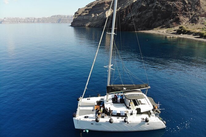 Half-Day Exclusive Catamaran Cruise in Santorini with Meal and Open Bar - Red Beach and Santorini’s Southern Coast