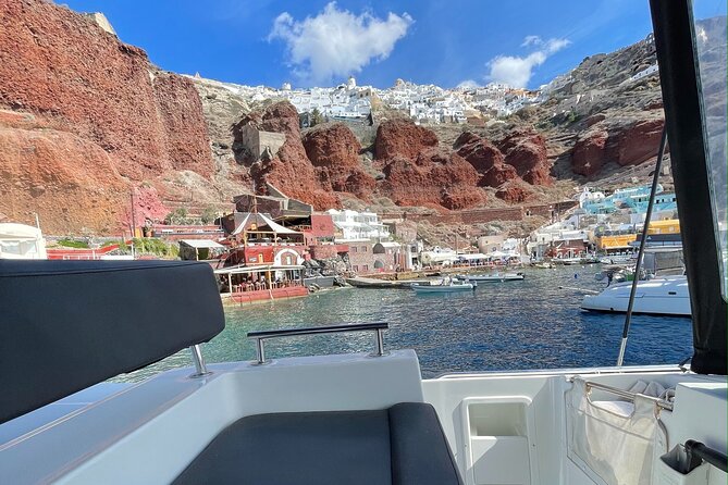 Half Day Premium Catamaran Cruise in Santorini including Oia - The Venetian lighthouse adds a fine closing view