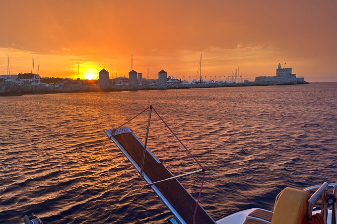 Half Day Sailing Catamaran with Sunset Experience - Sunset in front of Rhodes’ medieval town