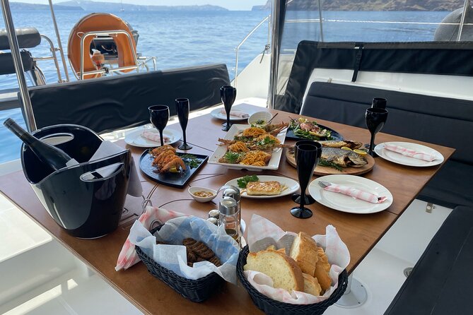 Half-Day Tailor-made Private Catamaran Cruise in Santorini - Passing the Akrotiri Lighthouse