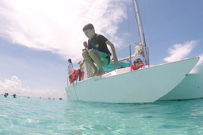 Isla Mujeres Catamaran Tour from Cancun with Snorkel and Open Bar - Snorkeling With Fish, Not a Quiet Reef Excursion