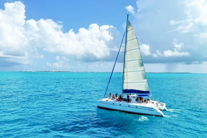 Isla Mujeres: Catamaran Tour with Snorkeling Food, Drinks, Beach - The spinnaker flight and weather limits