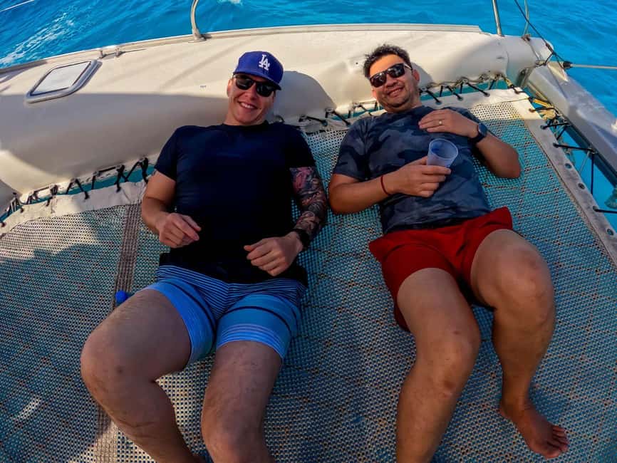 Isla Mujeres Catamaran Tour with Snorkeling & Open bar - The return ride, music, drinks, and possible spinnaker flight