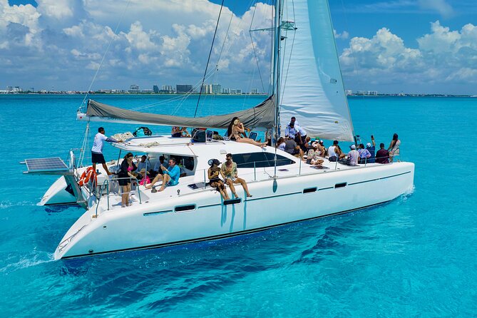 Isla Mujeres Spring Break Party Catamaran Snorkel and Open Bar - Snorkeling in clear Caribbean water