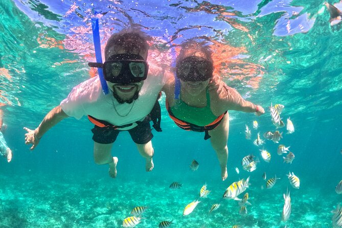 Isla Mujeres Spring Break Party Catamaran Snorkel and Open Bar - Playa Centro, shops, and a slower island break